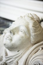A woman's head in plaster for restoration by a plasterer