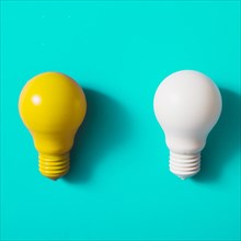 Yellow white light bulb turquoise background