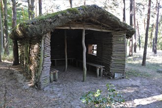 Rest hut made of natural materials in the forest