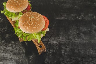 Dark surface with delicious burgers