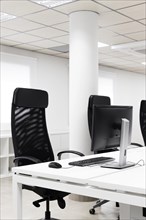 Empty conference room with black office chairs