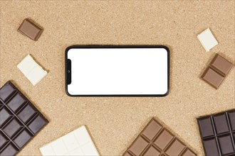 Top view chocolate bars with smartphone