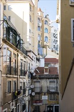 Alley with houses standing close to each other in the Alfama