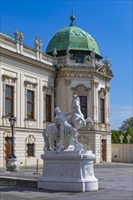 Stone horse and rider figure in front of the Belvedere Upper Baroque Palace