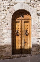 Antique wooden door in Assisi