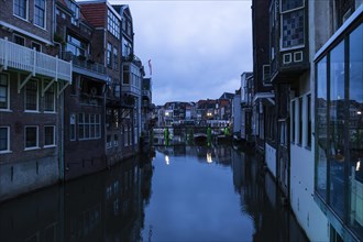 Gracht with old houses in the blue hour in Dordrecht