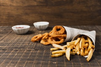Onion rings fries wooden table
