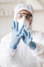 Blurred man wearing protective gloves