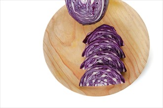 Sliced purple cabbage on a wooden board with white background