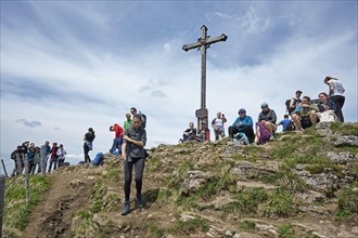 Many hikers rest at the summit of the Rotwand