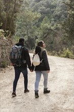 Couple with backpack exploring nature 8
