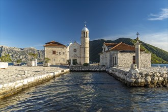 The artificial island of Gospa od Skrpjela with the church of St Mary on the rock near Perast on the Bay of Kotor