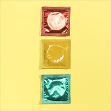 Top view red yellow green condoms