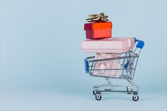 Gifts stacked shopping card blue surface