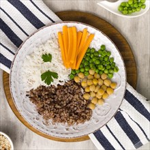 Different types porridge with vegetables big wooden board