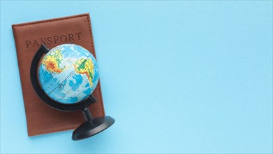 Flat lay passport world globe