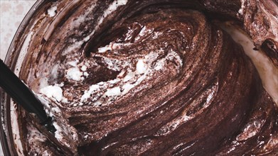 Close up mixed chocolate cake dough bowl