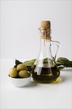 Close up bottle organic olive oil olives