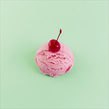 Pink ice cream ball with cherry