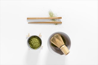 Top view matcha concept with bamboo whisk