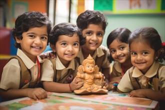 Happy Indian children with Buddha statue in the kindergarten