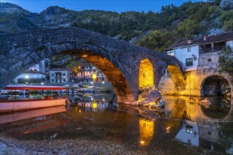 The Old Bridge Stari Most over the Crnojevic River in Rijeka Crnojevica at dusk