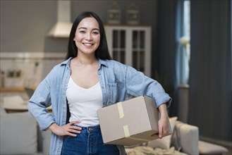 Smiley woman holding boxes she ordered online