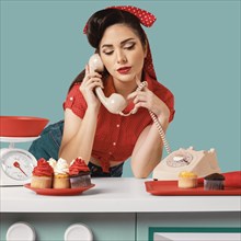 Pinup girl posing kitchen