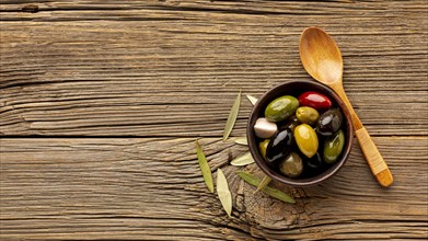 Olives mix wooden spoon with copy space