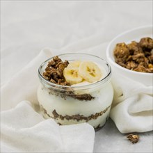 Close up delicious yogurt with granola banana