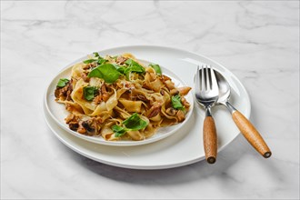 Fettuccine pasta with champignon on a plate