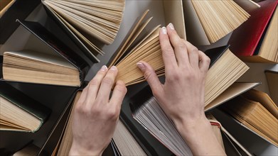 Hands touching books