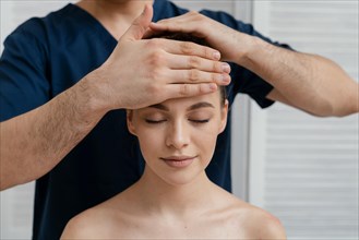 Close up relaxed woman being massaged