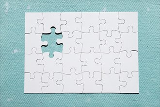 Missing piece puzzle blue textured backdrop