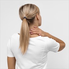 Back view woman with neck pain