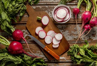 Top view radishes with knife