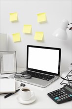Side view desk arrangement with post its wall