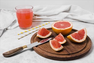 High angle grapefruit slices with juice