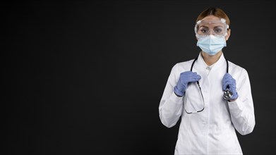 Female doctor wearing protective medical equipment