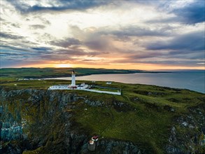 Sunset over Mull of Galloway Lighthouse from a drone