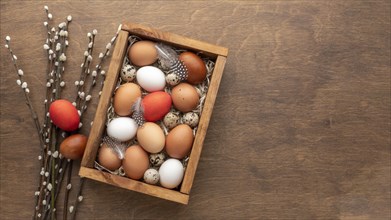 Flat lay box with eggs easter copy space