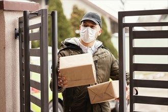 Delivery man package wearing mask