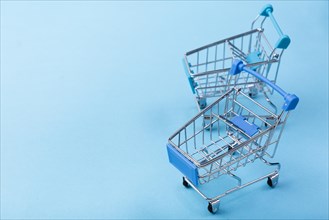 Shopping carts blue background with copy space