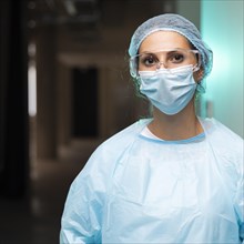 Female doctor wearing protective clothing