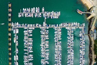 Top Down view over Boats and Yachts in Brixham Marina from a drone