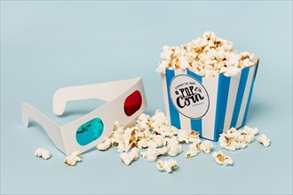 3d glasses with popcorns box blue backdrop