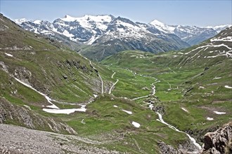 Photo with reduced dynamic saturation HDR of mountain pass alpine mountain road alpine road pass road pass Col de l'Iseran