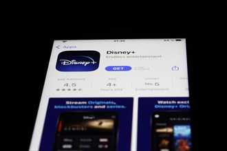 Detailed view of a smartphone with Disney Plus Streaming App in the iPhone App Store