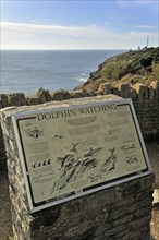 Dolphin watching information board at Durlston Head on the Isle of Purbeck along the Jurassic Coast in Dorset