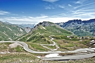 Photo with reduced dynamic saturation HDR of mountain pass alpine mountain road alpine road pass road pass in French Alps